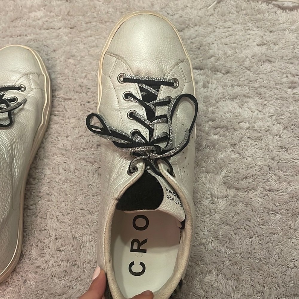 silver sneakers with black and zebra detailing
